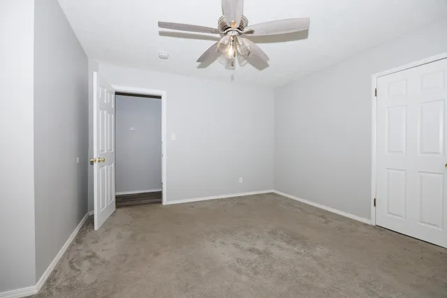 an empty room with fan