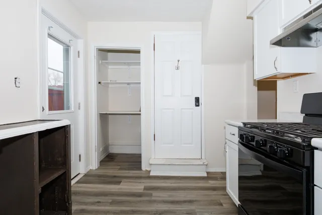 a kitchen with a stove and a refrigerator