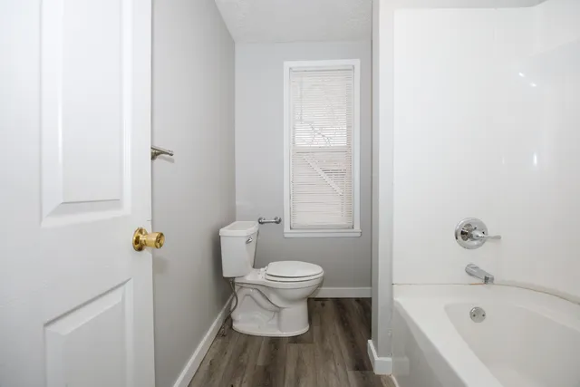 a bathroom with a toilet and a sink