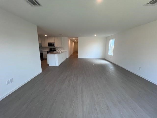 8 Robin Court Angleton, TX 77515 - Photo 22 of 41 a view of a kitchen with a sink and a window
