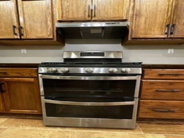 217 Liberty Road Jackson, TN 38305 - Photo 14 of 25 a stove top oven sitting inside of a kitchen