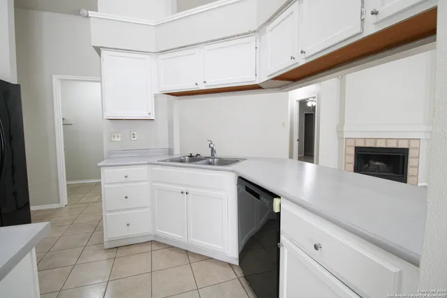 a kitchen with a sink and cabinets