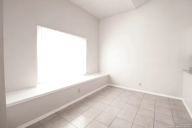 a view of an empty room and window