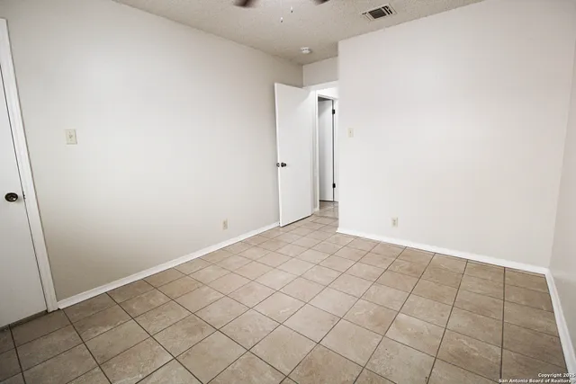 a view of a room with white walls