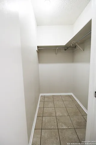 an empty room with a bench