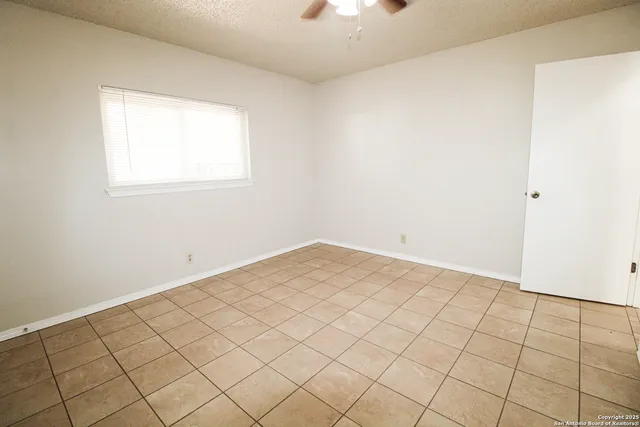 a view of a room with white walls