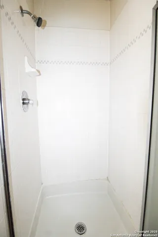 a view of a yard with large trees