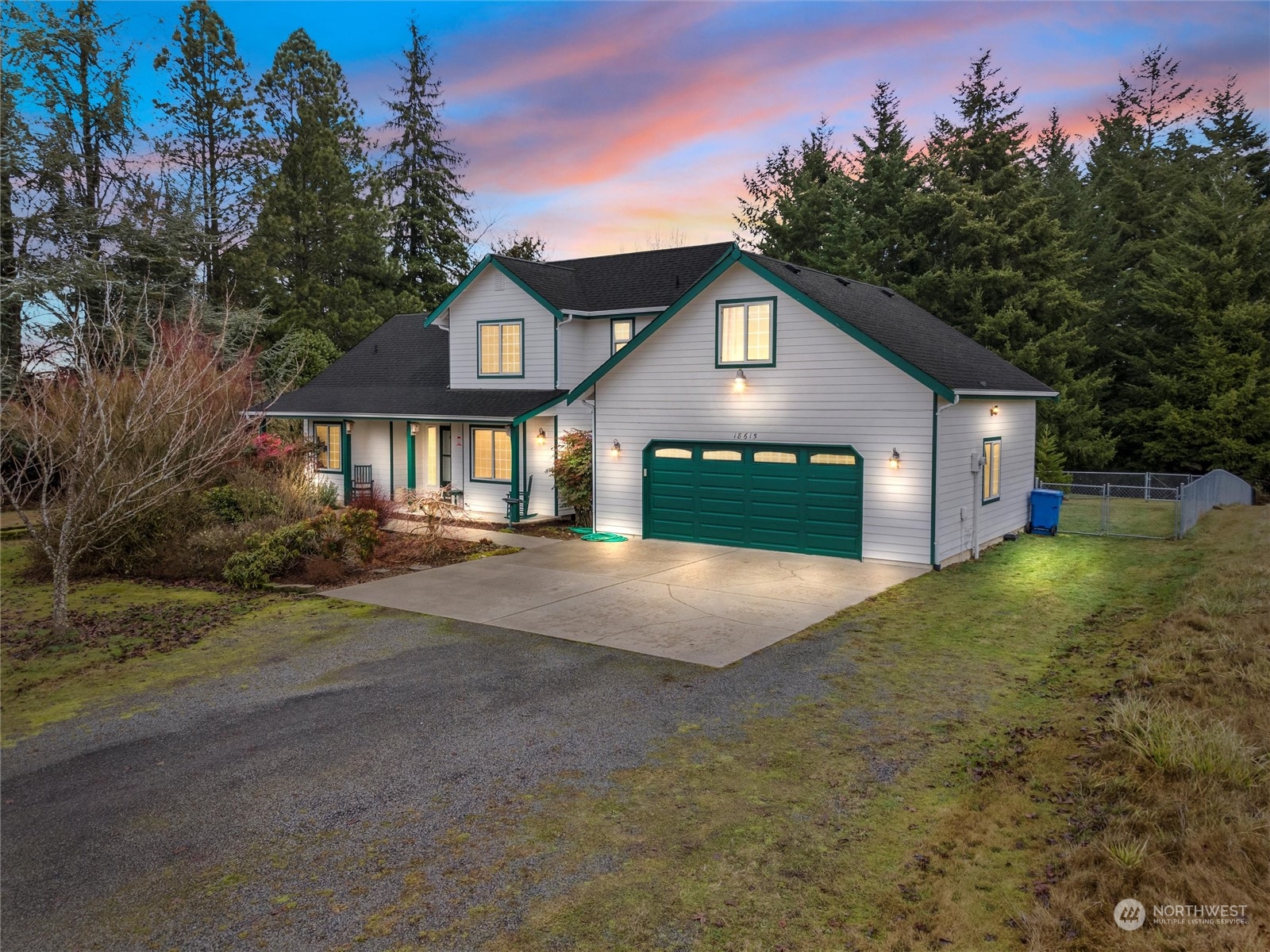 18615 Roseburg Street Southwest Rochester, WA 98579 - Photo 1 of 40 a front view of a house with a yard and garage