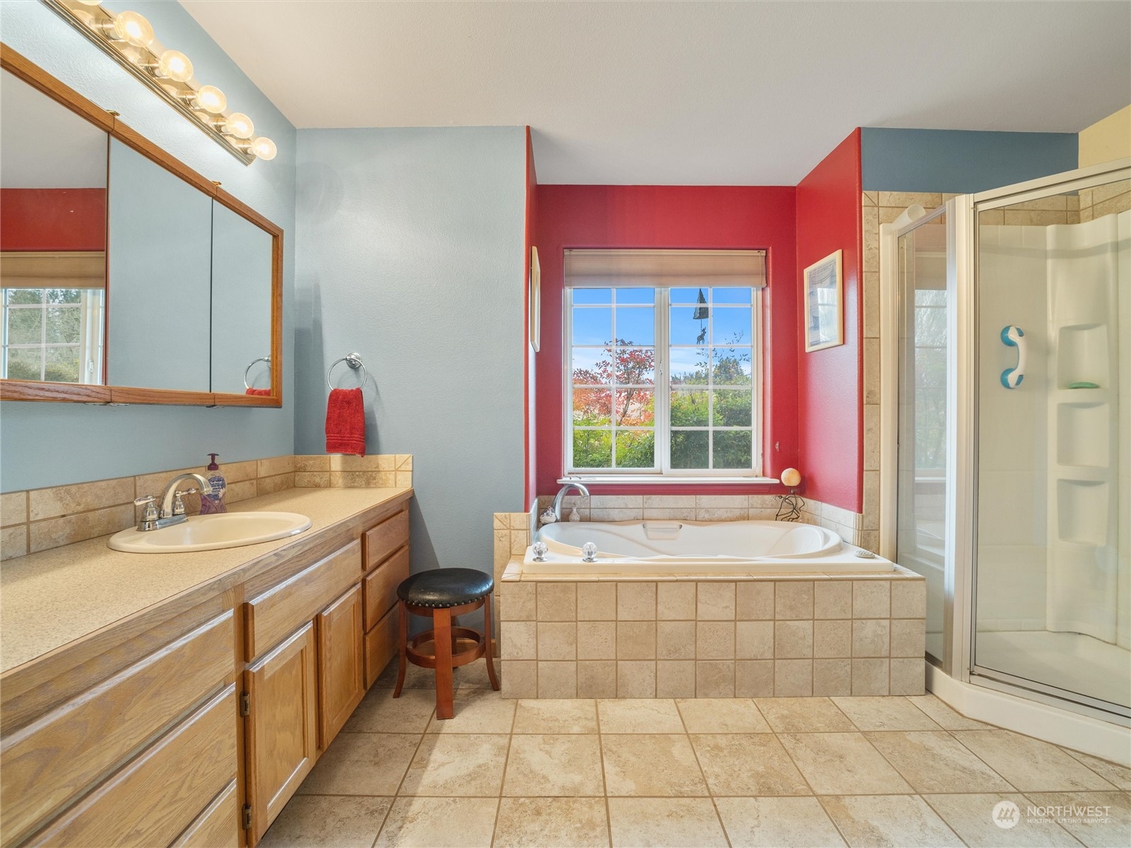 18615 Roseburg Street Southwest Rochester, WA 98579 - Photo 23 of 40 a bathroom with a tub sink and mirror