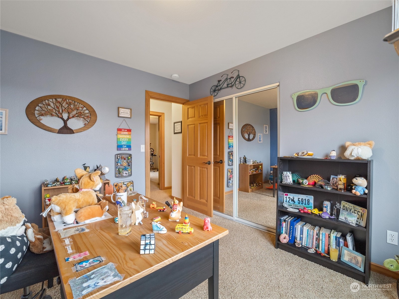 18615 Roseburg Street Southwest Rochester, WA 98579 - Photo 26 of 40 a view of a dining room with furniture and a book shelf