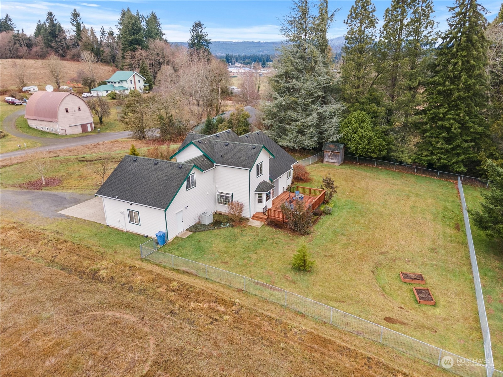 18615 Roseburg Street Southwest Rochester, WA 98579 - Photo 35 of 40 a view of a house with a yard