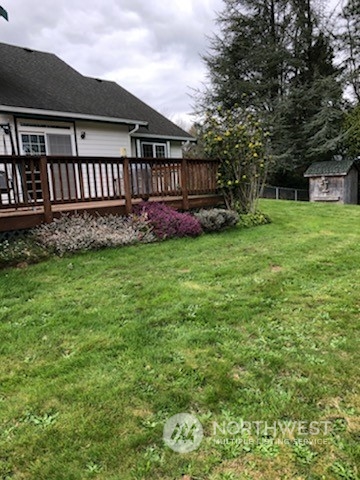 18615 Roseburg Street Southwest Rochester, WA 98579 - Photo 40 of 40 a view of a house with a yard and a garden