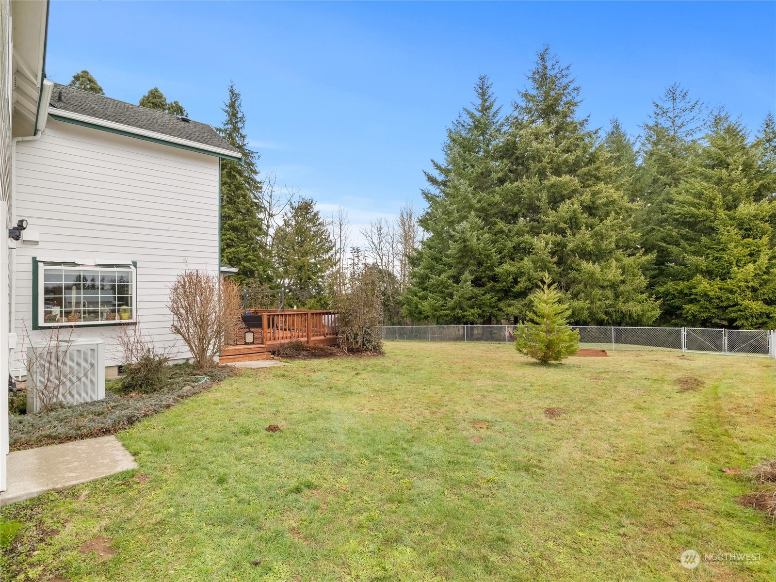 18615 Roseburg Street Southwest Rochester, WA 98579 - Photo 6 of 40 a view of a house with a yard