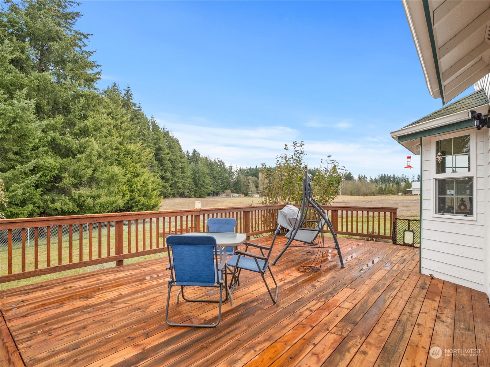 18615 Roseburg Street Southwest Rochester, WA 98579 - Photo 9 of 40 a view of a deck with wooden floor and seating space