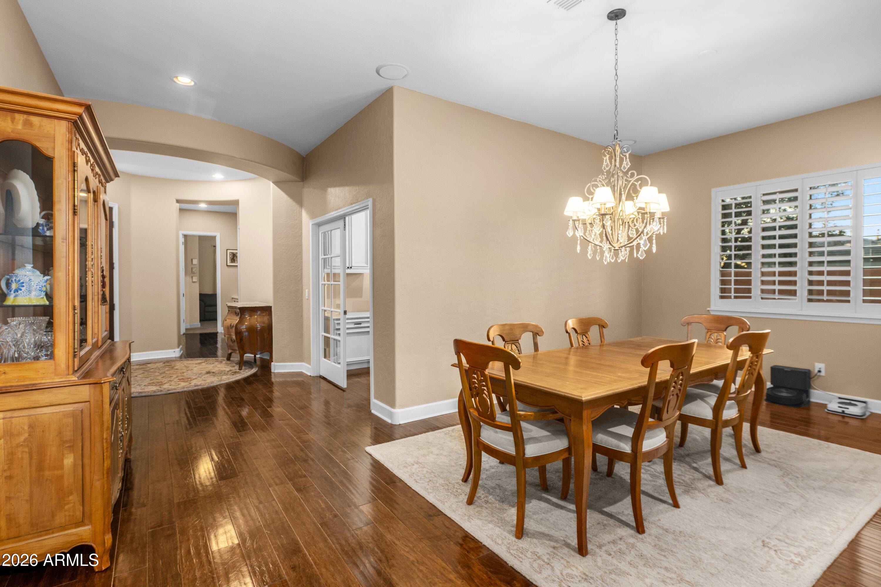 3738 East Riopelle Avenue Gilbert, AZ 85298 - Photo 12 of 97 a view of a dining room with furniture and chandelier