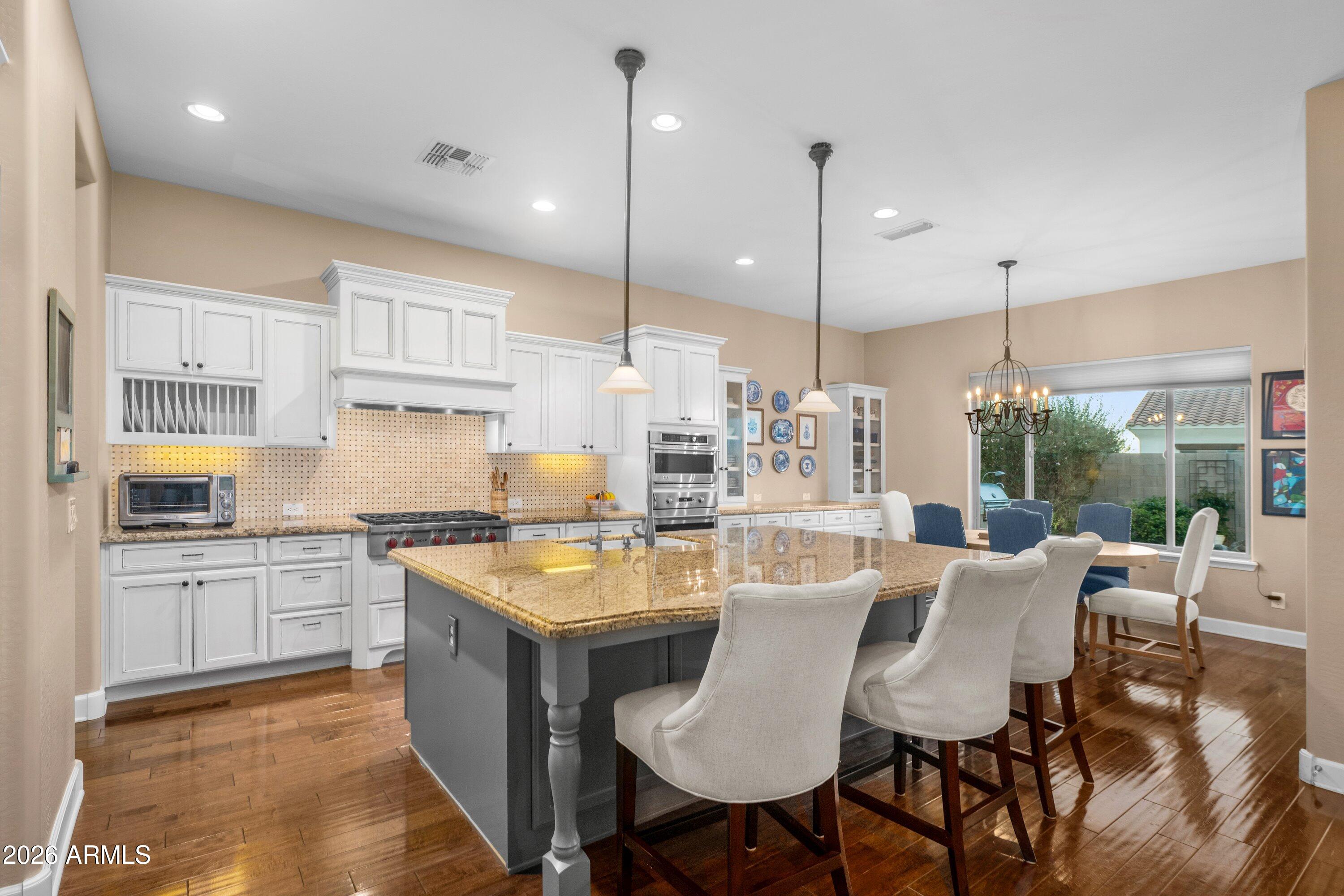 3738 East Riopelle Avenue Gilbert, AZ 85298 - Photo 17 of 97 a large kitchen with kitchen island a large island in it