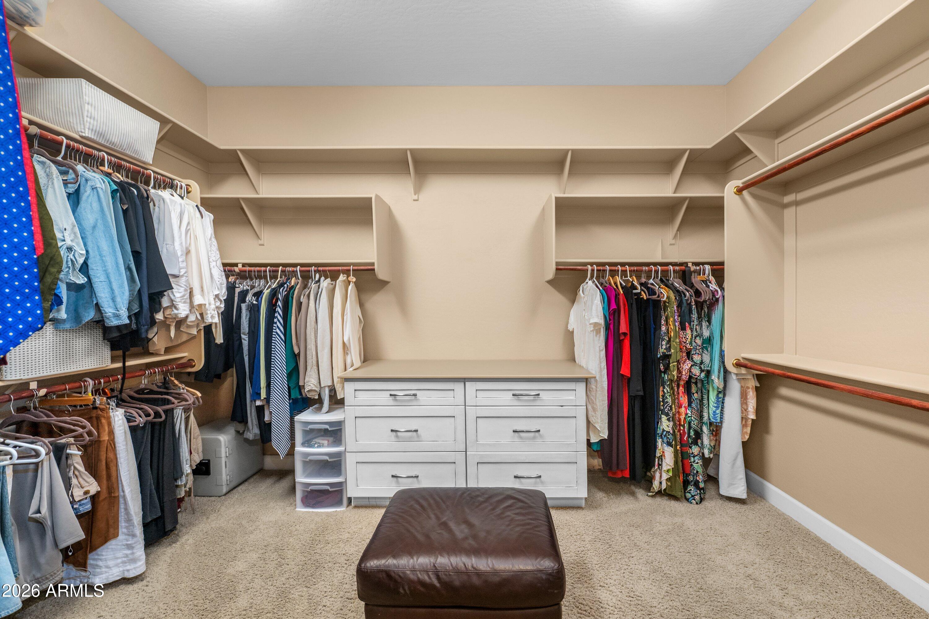 3738 East Riopelle Avenue Gilbert, AZ 85298 - Photo 35 of 97 a view of walk in closet with clothes and shoes