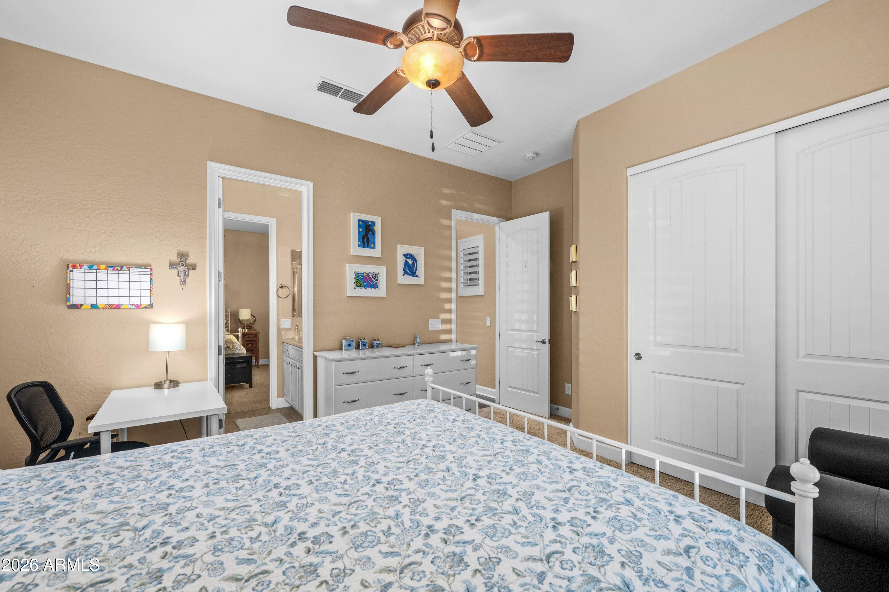 3738 East Riopelle Avenue Gilbert, AZ 85298 - Photo 38 of 97 a bedroom with a bed and a dresser