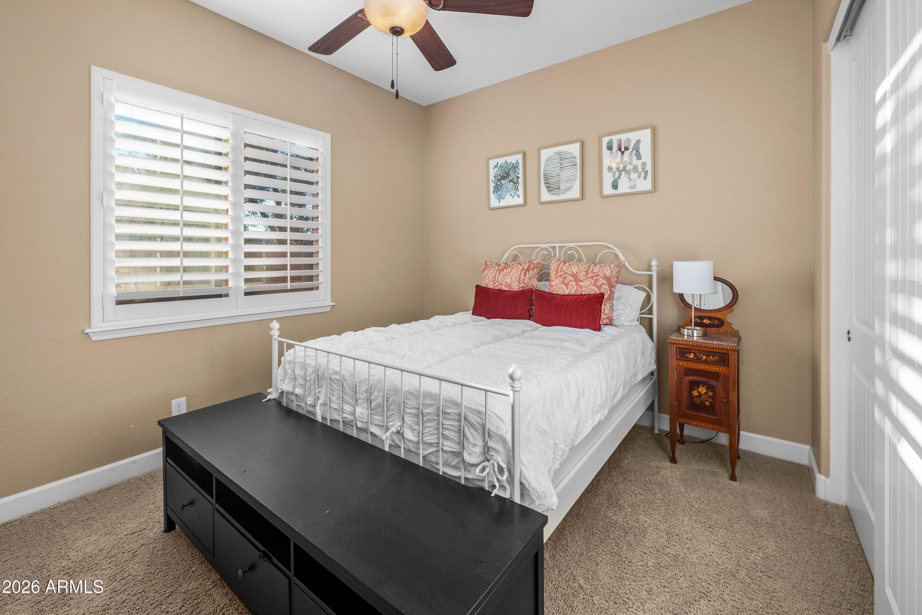 3738 East Riopelle Avenue Gilbert, AZ 85298 - Photo 40 of 97 a bedroom with a bed and a window