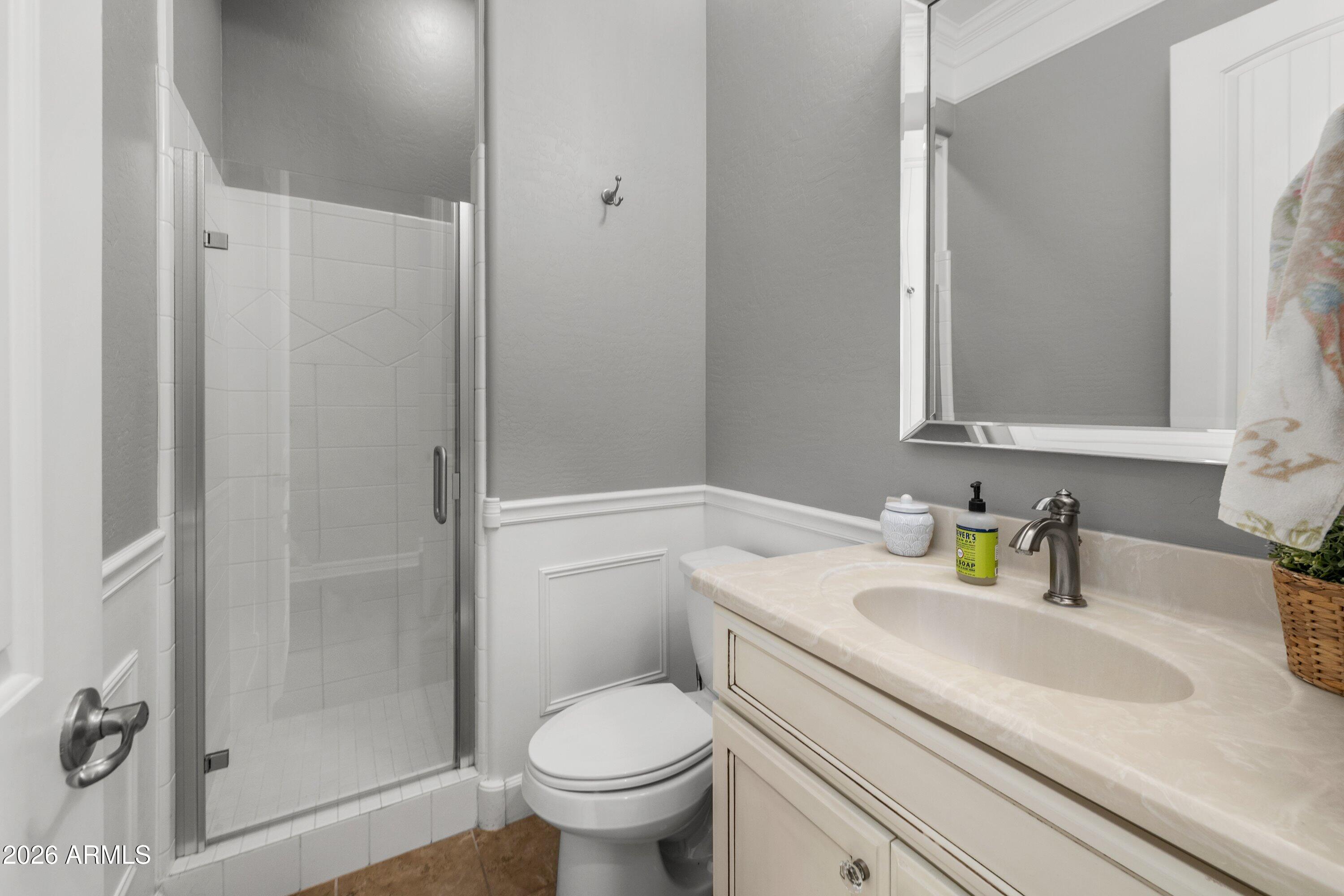 3738 East Riopelle Avenue Gilbert, AZ 85298 - Photo 44 of 97 a bathroom with a sink toilet and shower