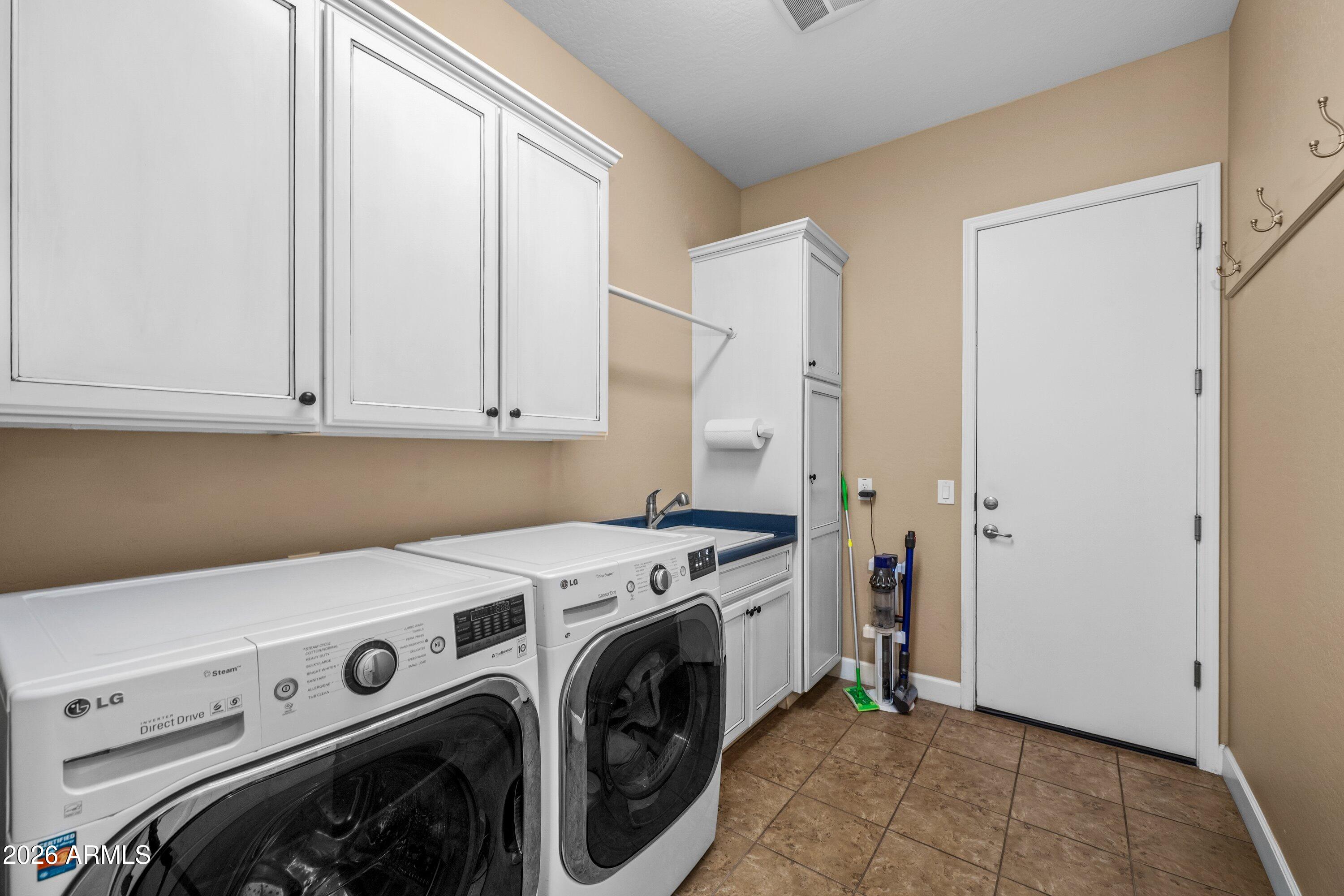 3738 East Riopelle Avenue Gilbert, AZ 85298 - Photo 45 of 97 a utility room with dryer and washer
