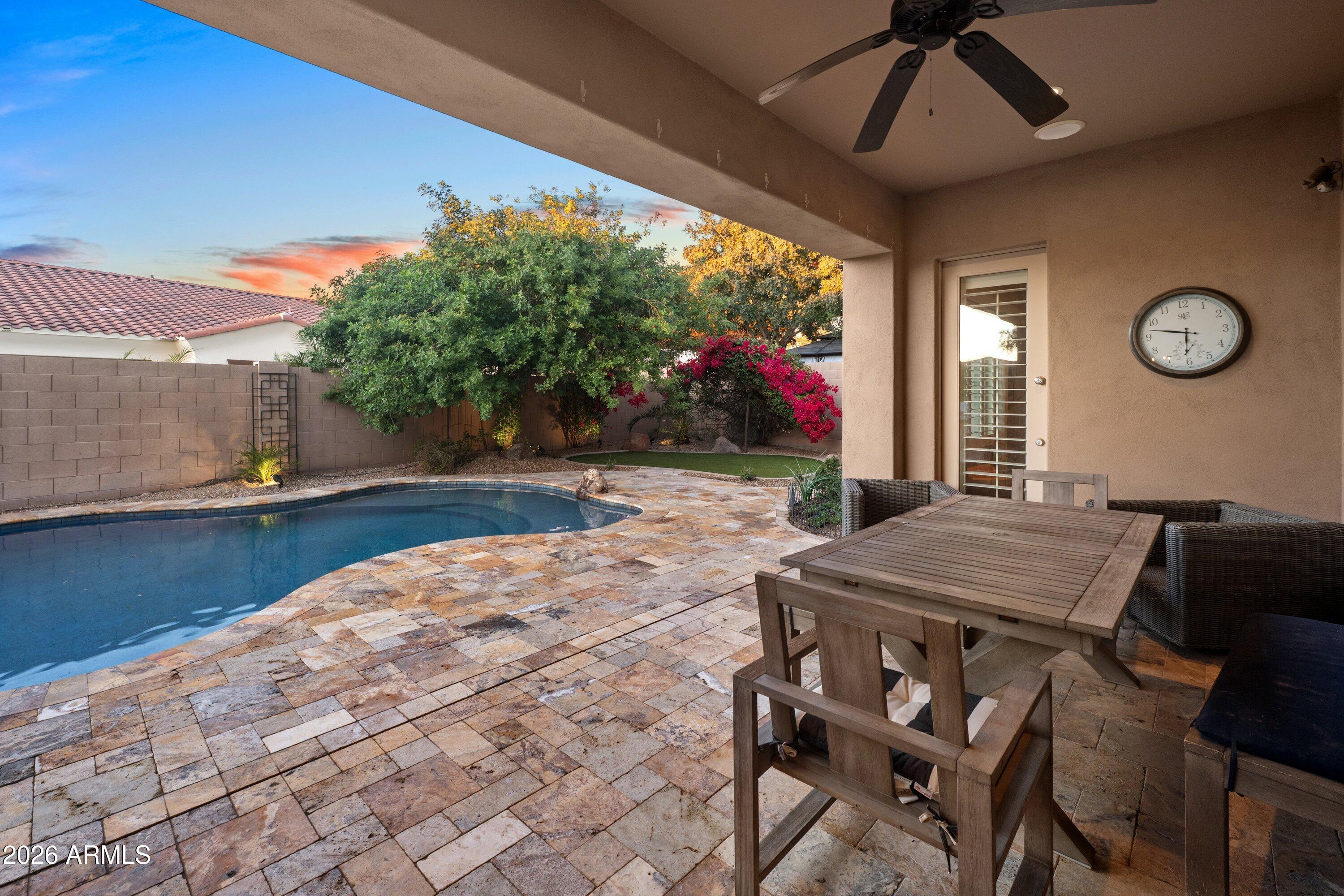 3738 East Riopelle Avenue Gilbert, AZ 85298 - Photo 46 of 97 a view of a dining room with furniture and a chandelier