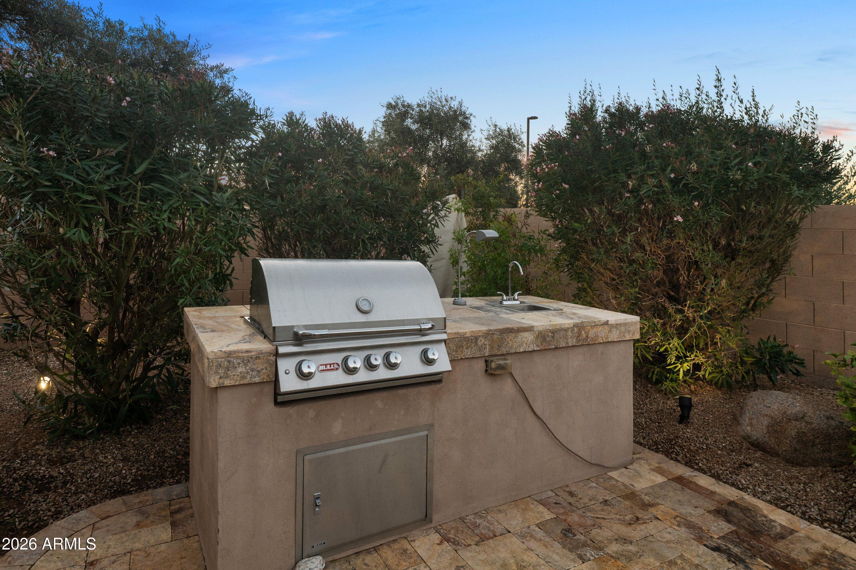 3738 East Riopelle Avenue Gilbert, AZ 85298 - Photo 49 of 97 a view of a yard with an outdoor and sitting space