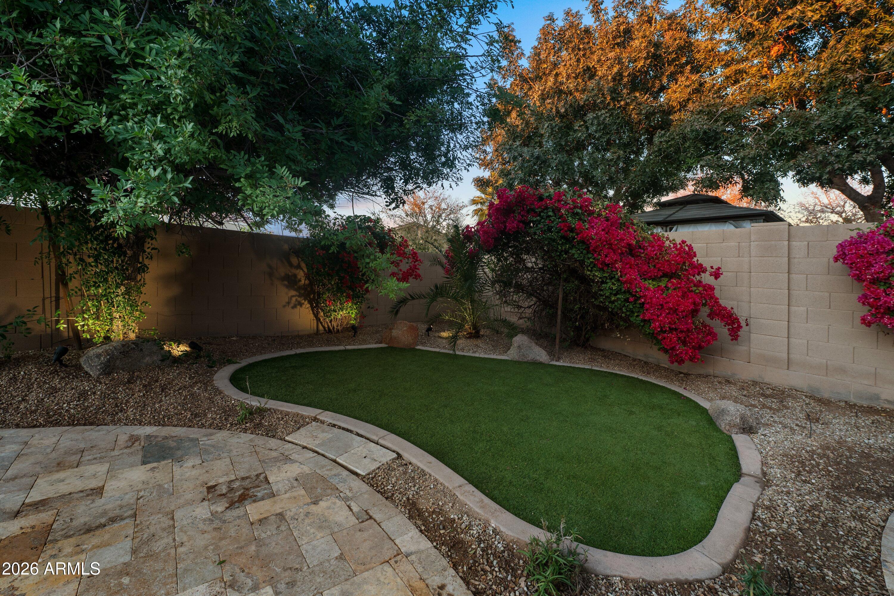 3738 East Riopelle Avenue Gilbert, AZ 85298 - Photo 54 of 97 a backyard of a house with lots of green space