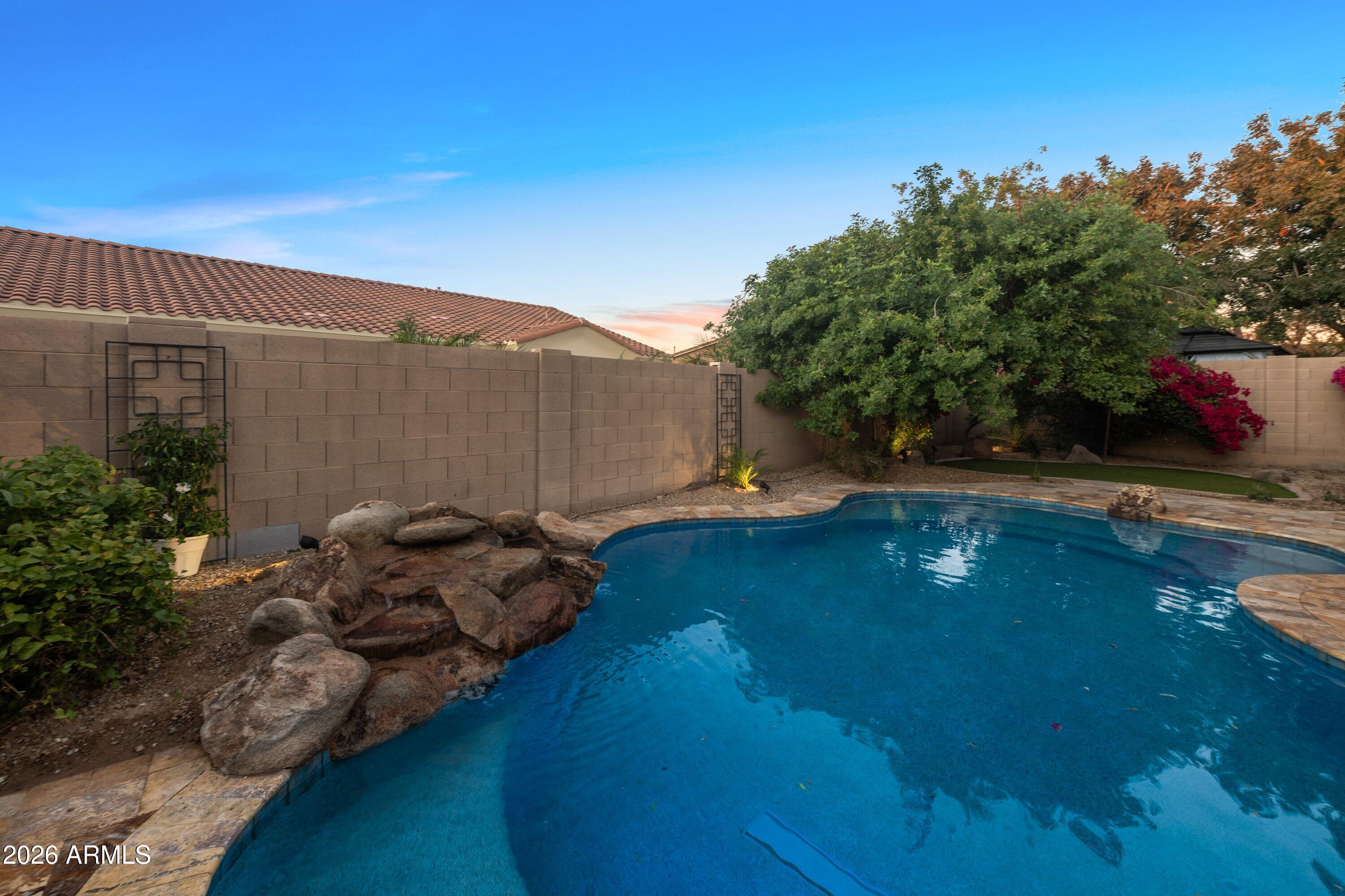 3738 East Riopelle Avenue Gilbert, AZ 85298 - Photo 58 of 97 a backyard of a house with lots of green space