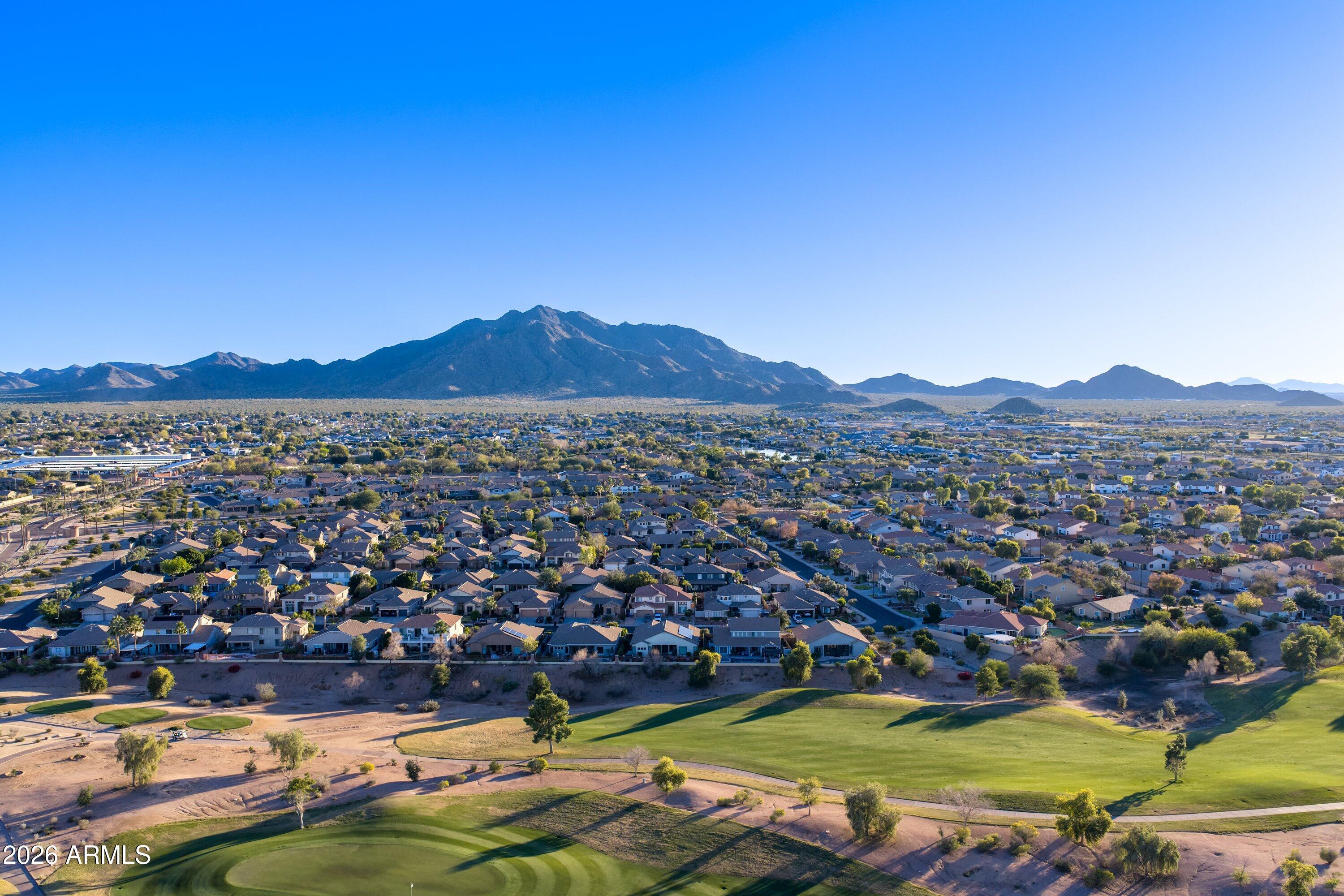 3738 East Riopelle Avenue Gilbert, AZ 85298 - Photo 79 of 97 a view of a town with mountains in the background