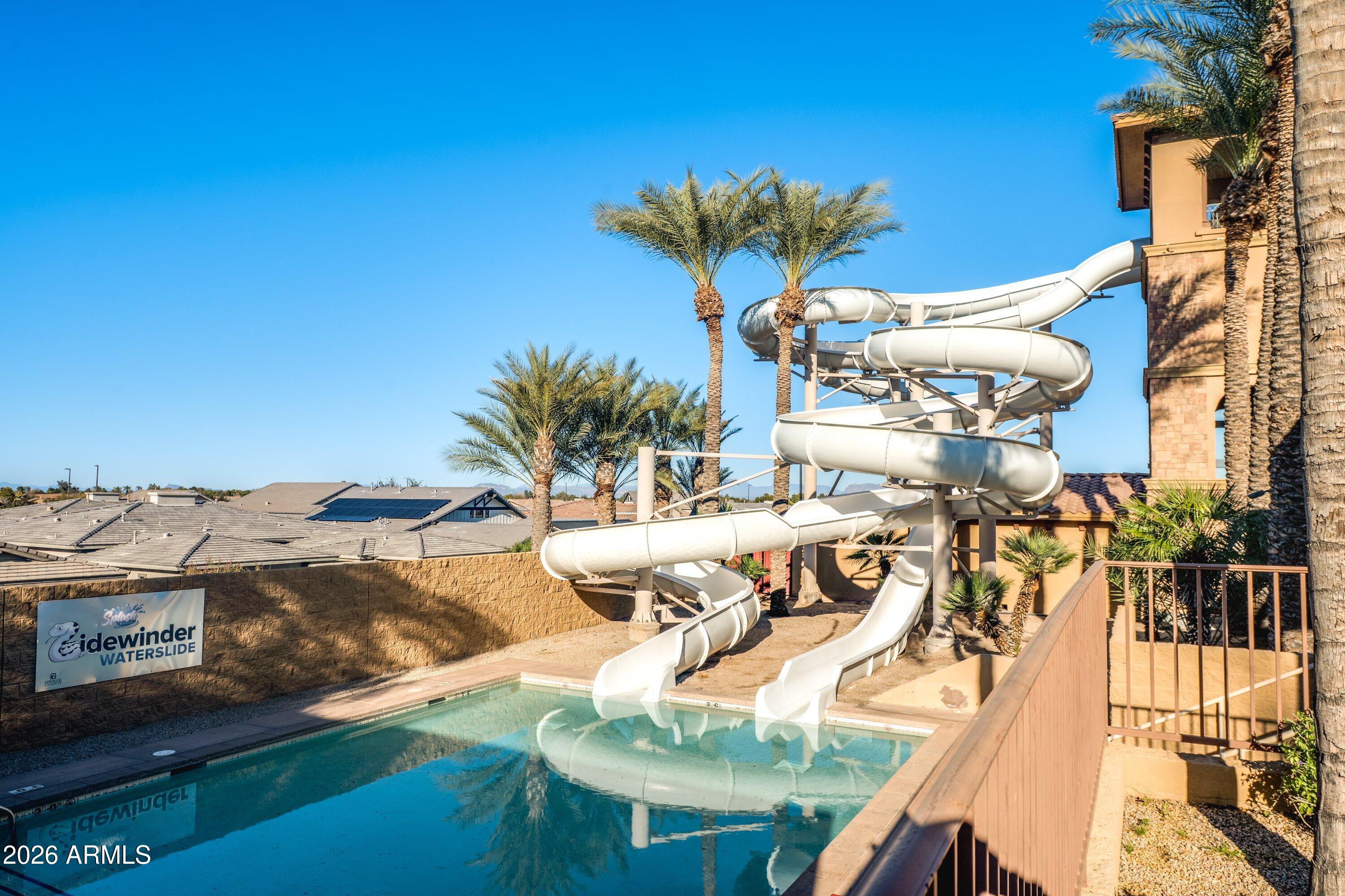 3738 East Riopelle Avenue Gilbert, AZ 85298 - Photo 85 of 97 a view of a swimming pool with a table and chairs