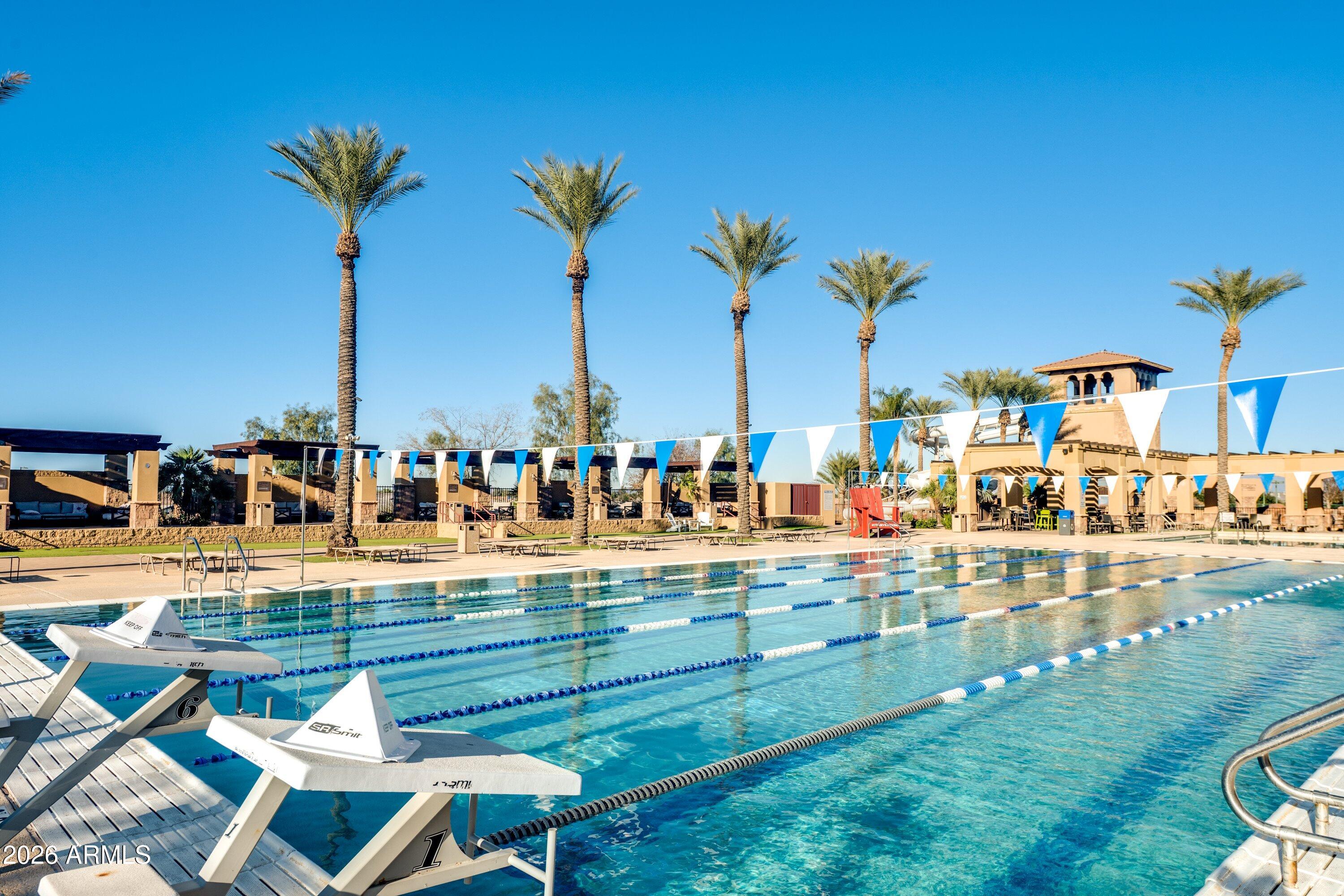 3738 East Riopelle Avenue Gilbert, AZ 85298 - Photo 90 of 97 a view of a swimming pool with a table and chairs