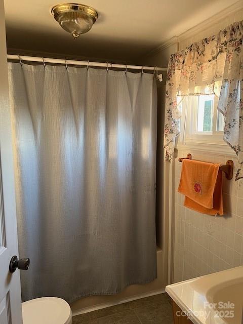 70 3rd Street, Unit 87 Marion, NC 28752 - Photo 12 of 22 a bathroom with a shower and a toilet