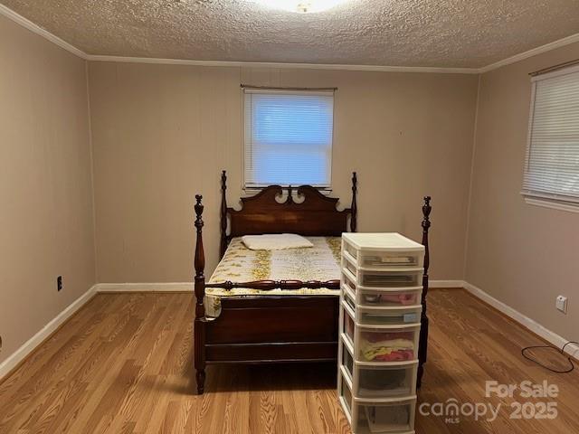 70 3rd Street, Unit 87 Marion, NC 28752 - Photo 14 of 22 a bedroom with a bed and a window