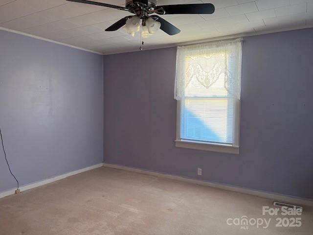 70 3rd Street, Unit 87 Marion, NC 28752 - Photo 17 of 22 an empty room with a window and a ceiling fan