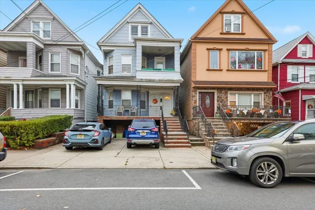 a car parked in front of a house