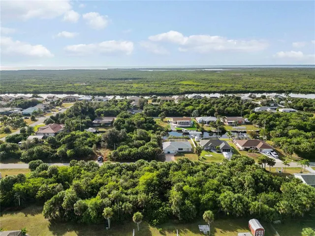an aerial view of a house with a lake view