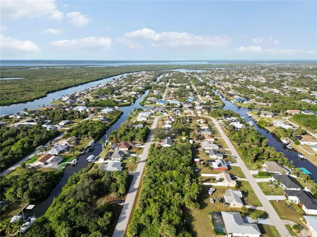 an aerial view of residential building with green space