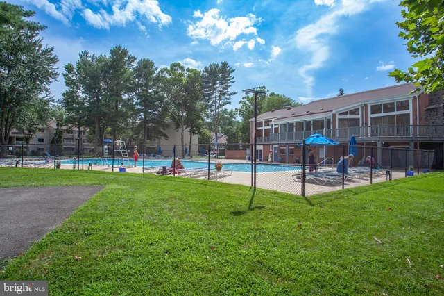 a view of a house with a backyard and a garden