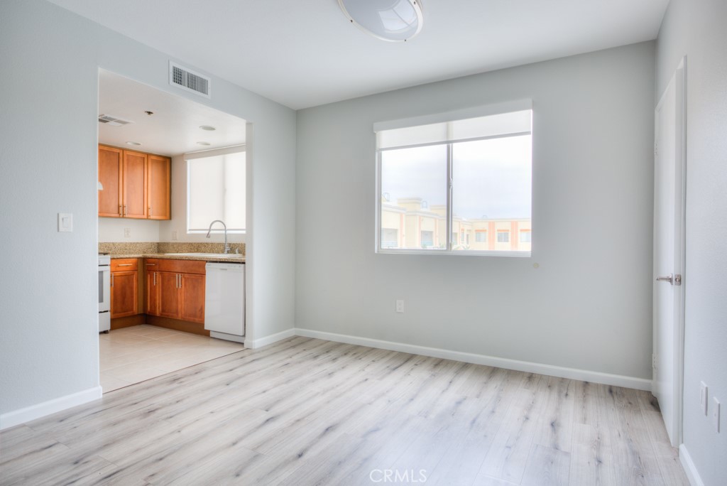 580 West Main Street, Unit 302 Alhambra, CA 91801 - Photo 13 of 41 wooden floor in an empty room with a window