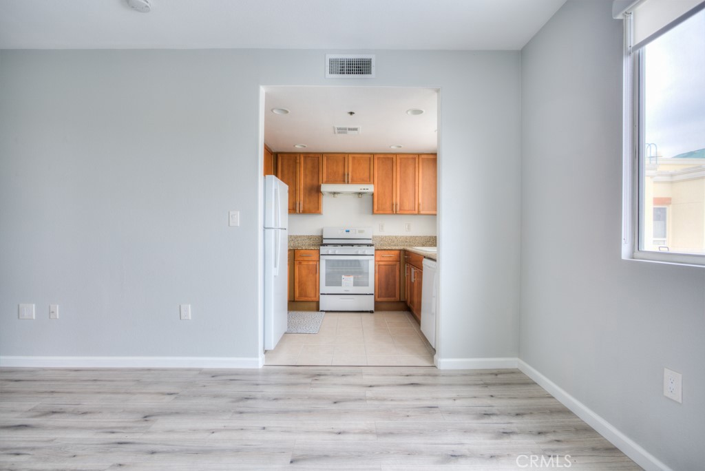 580 West Main Street, Unit 302 Alhambra, CA 91801 - Photo 15 of 41 a view of a kitchen with wooden floor and a sink