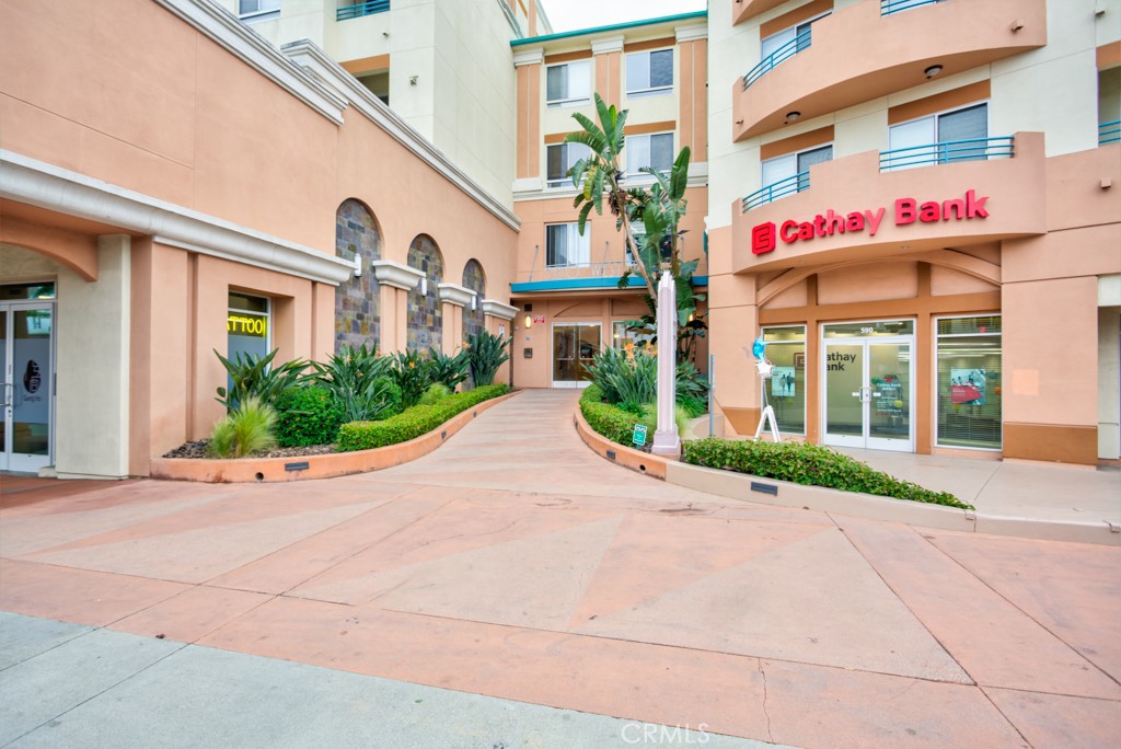 580 West Main Street, Unit 302 Alhambra, CA 91801 - Photo 2 of 41 a front view of a building with garden