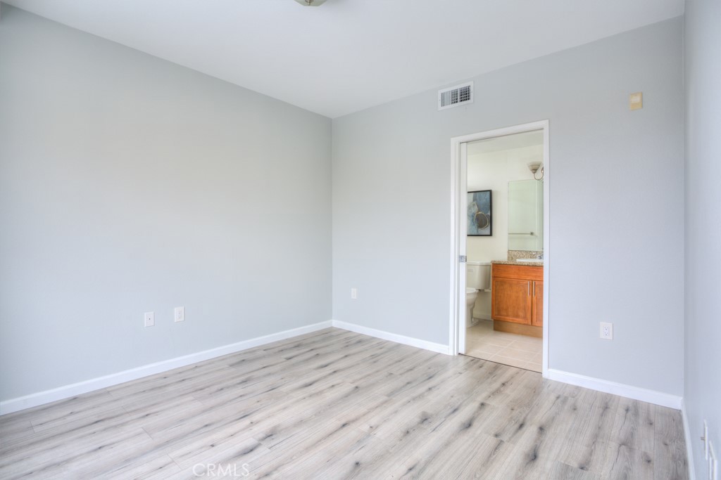 580 West Main Street, Unit 302 Alhambra, CA 91801 - Photo 21 of 41 a view of a room with wooden floor and a bathroom
