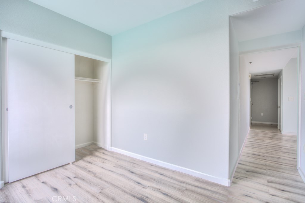 580 West Main Street, Unit 302 Alhambra, CA 91801 - Photo 27 of 41 a view of an empty room with wooden floor