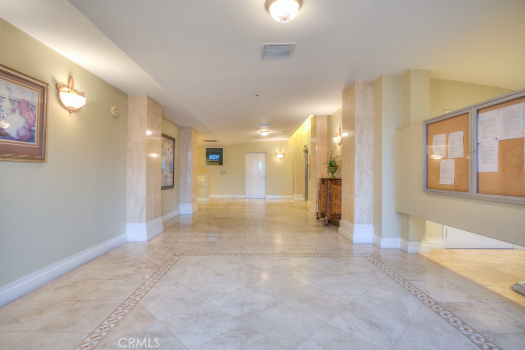580 West Main Street, Unit 302 Alhambra, CA 91801 - Photo 3 of 41 a view of a hallway with wooden floor