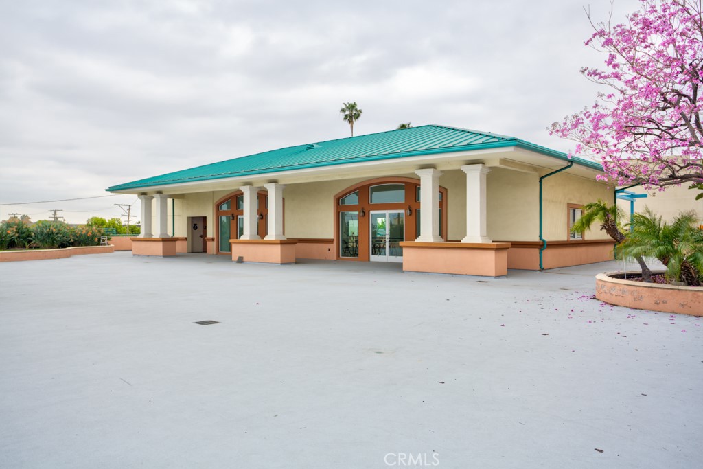 580 West Main Street, Unit 302 Alhambra, CA 91801 - Photo 32 of 41 a front view of a house with a yard