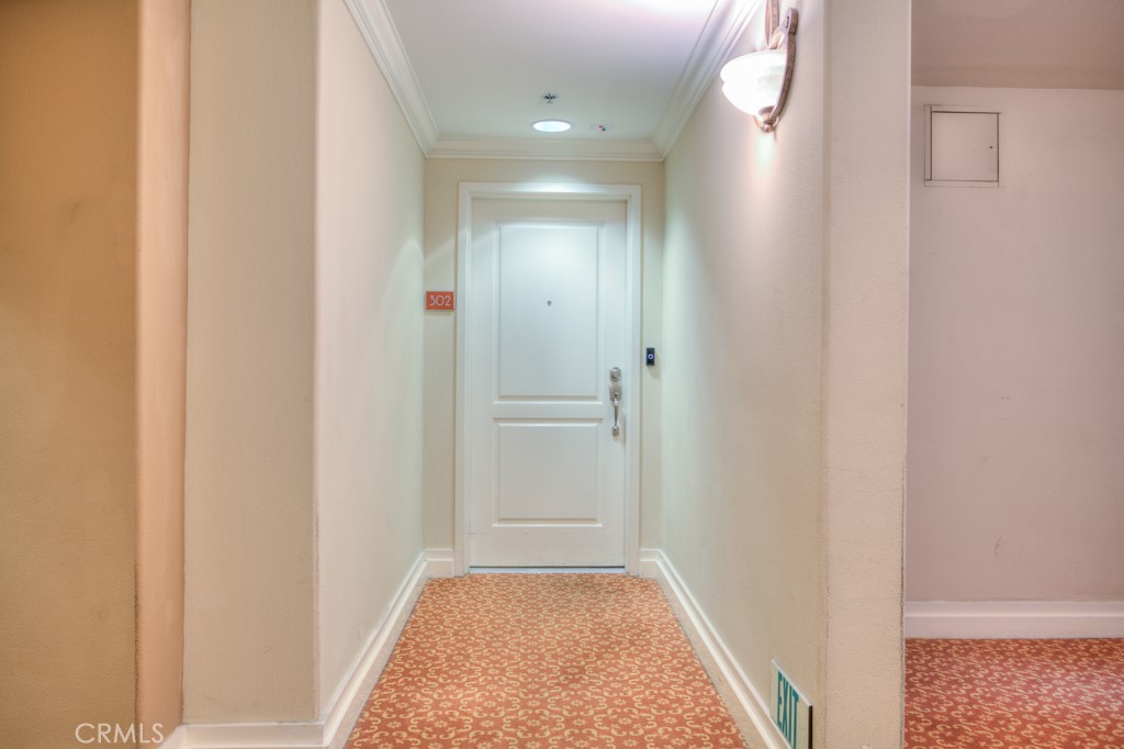 580 West Main Street, Unit 302 Alhambra, CA 91801 - Photo 6 of 41 a view of a hallway with a white walls