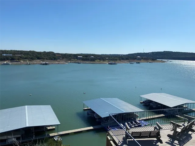 an aerial view of a house with table and chairs