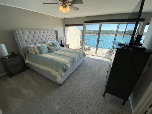 a bed room with a bed and a television