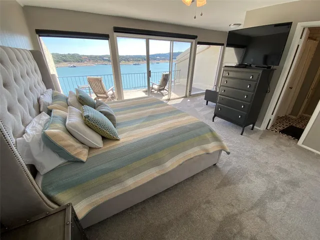 a bathroom with a sink mirror vanity and toilet